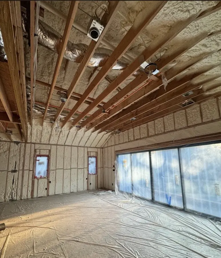 Interior walls and ceiling insulated with spray foam during new construction in Tanglewilde